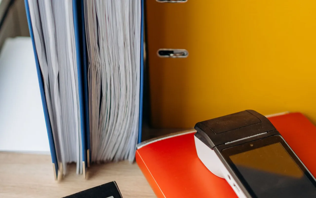 Calculator and business documents on a desk